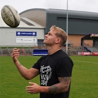 Isaac Marsh of Kaizen Rugby with a rugby ball